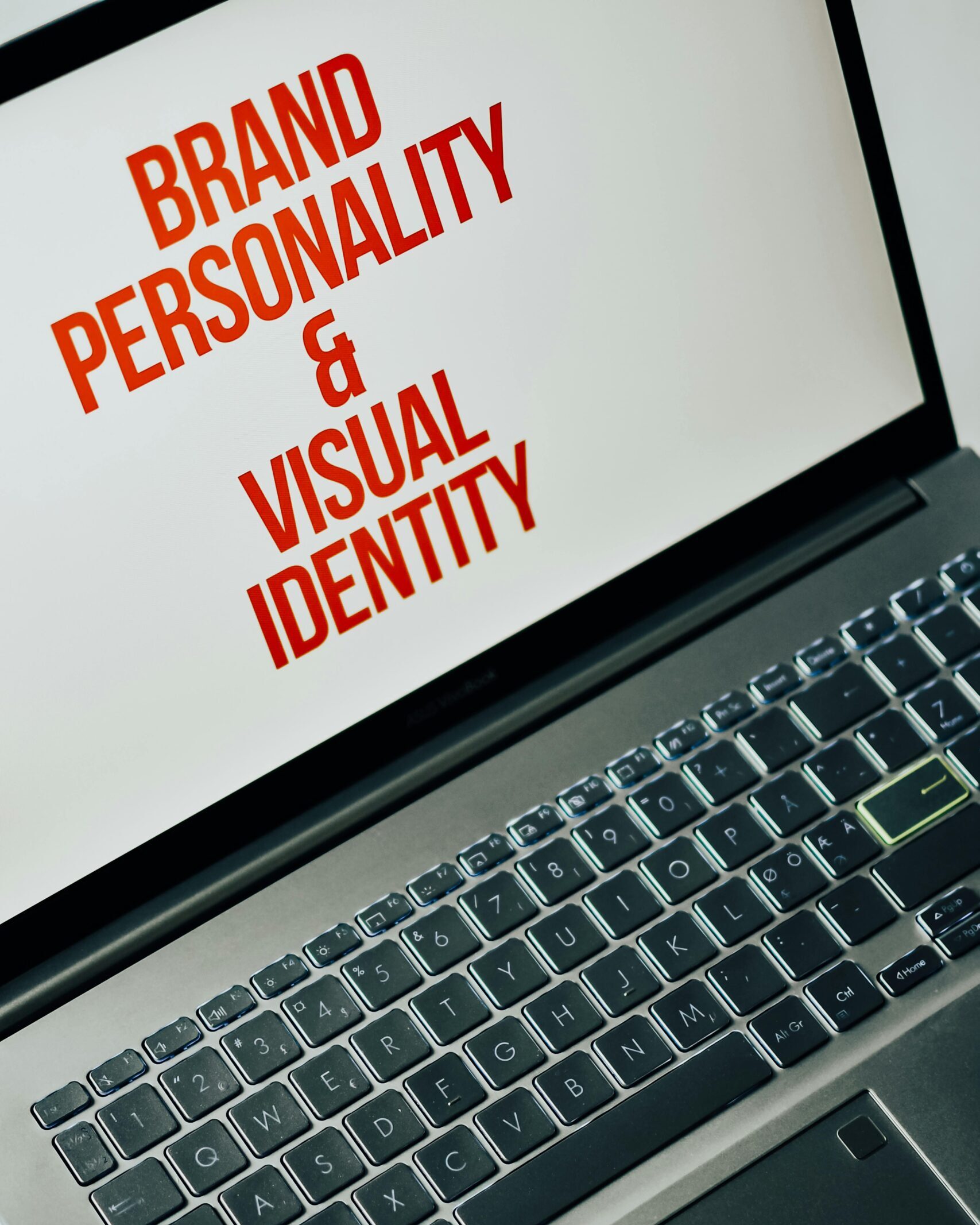 Laptop screen showing text on brand personality and visual identity for marketing strategy.